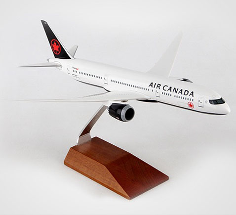 Photo of Air Canada model airplane mounted on a wood pedestal